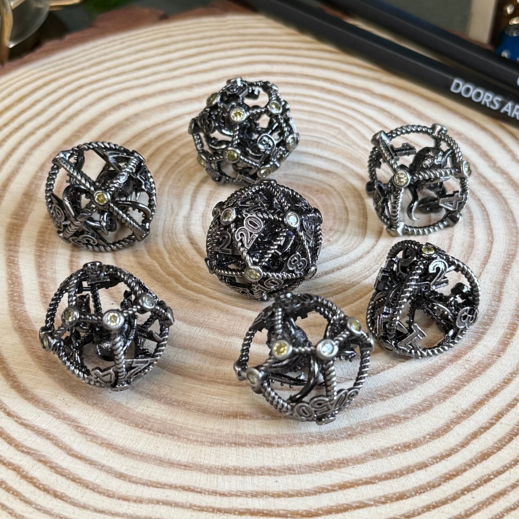 Hollow Octopus Cage 7 Piece Metal Poly Dice Set - The Wandering Satchel