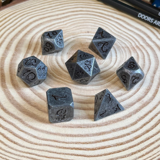 Solid Metal Dragon Font 7 Piece Metal Poly Dice Set - The Wandering Satchel